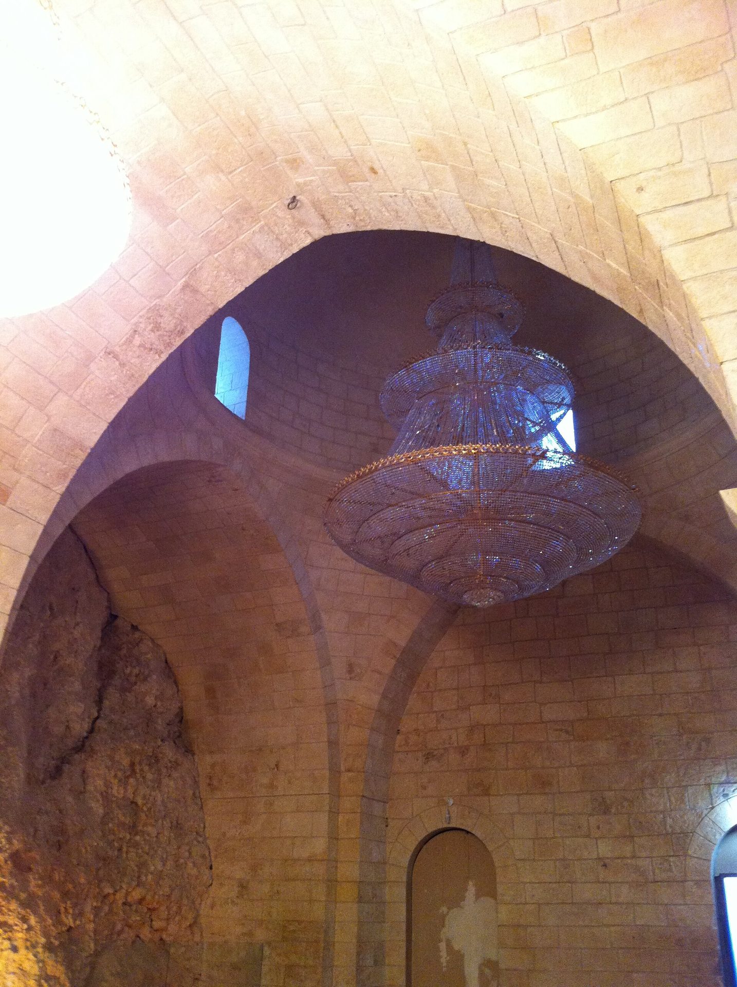 Interior of the shrine of Nabi Shu'ayb with carpets and draped fabrics