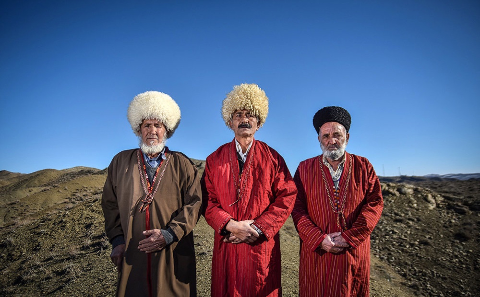 Three Turkmen men in tall sheepskin hats, Raz and Jargalan district, North Khorasan